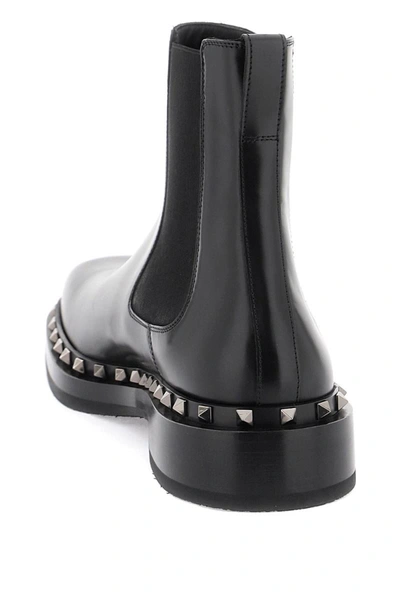 Shop Valentino Garavani Rockstud M-way Ankle Boots In Black