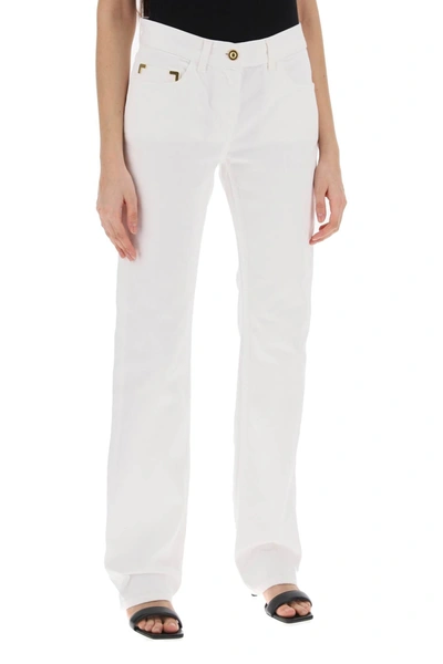 Shop Palm Angels Jeans With Gold Metal Detailing Women In White