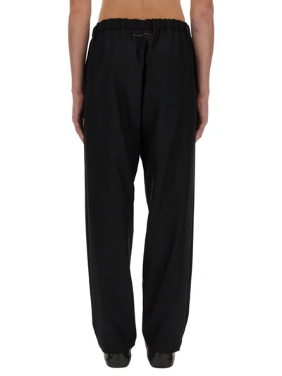 Shop Mm6 Maison Margiela Pants With Tapered Leg In Black