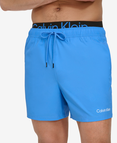 Shop Calvin Klein Men's Logo Elastic Waist Modern Euro 5" Volley Swim Trunks In Blue