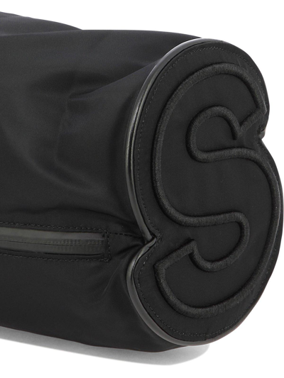 Shop Sacai Monogram-embroidered Drawstring Bucket Bag In Black