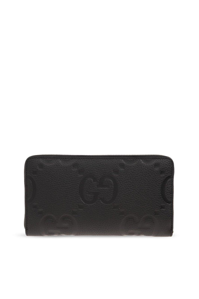 Shop Gucci Logo Embossed Zip-around Wallet In Black