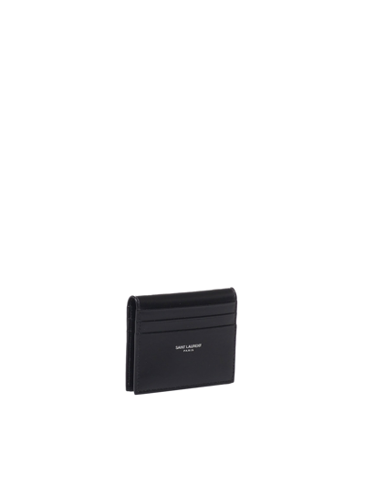 Shop Saint Laurent Compact And Reversible Leather Card Holder