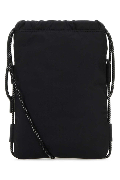 Shop Moncler Logo Patch Drawstring Crossbody Bag In Black