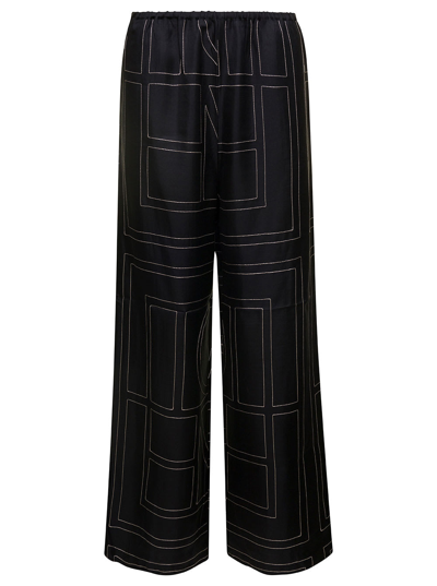 Shop Totême Black Loose Pants With Monogram Print In Silk Woman In Nero