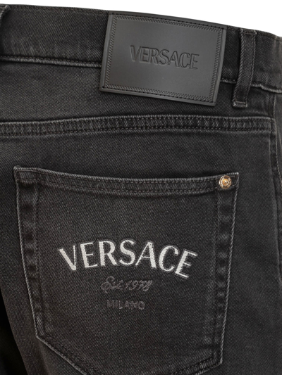 Shop Versace Medusa Jeans In Faded Washed Black