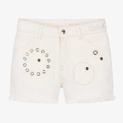 Shop Chloé Girls Ivory Eyelet Denim Shorts