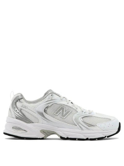 Shop New Balance "530" Sneakers