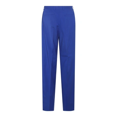Shop Versace Trousers In Blue