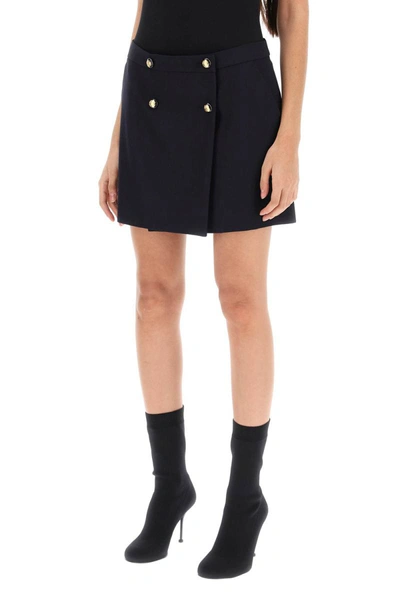 Shop Alexander Mcqueen Mini Wrap Skirt With Seal Buttons In Blue