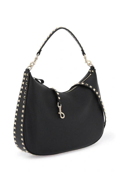 Shop Valentino Garavani Grained Leather 'rockstud' Hobo Bag In Black