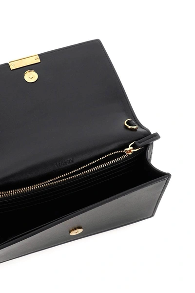 Shop Versace Greca Goddes Crossbody Bag In Black