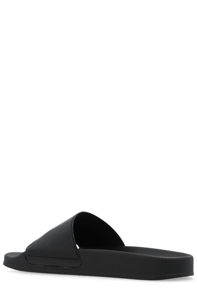 Shop Moschino Logo-embossed Slides In Black