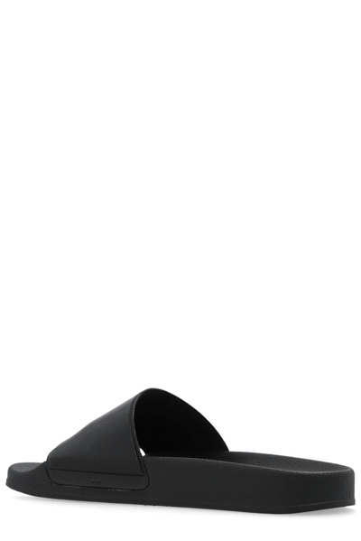 Moschino Logo-embossed Textured Slides In Black