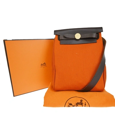 Shop Hermes Herbag Canvas Shoulder Bag () In Orange