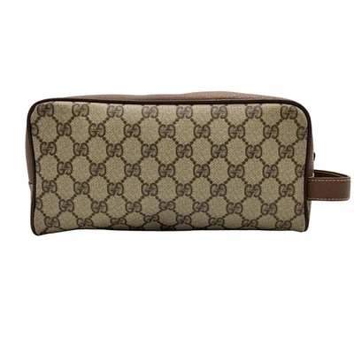 Shop Gucci Brown Canvas Clutch Bag ()