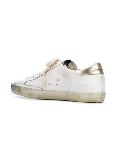 Shop Golden Goose White And Gold Superstar Sneakers