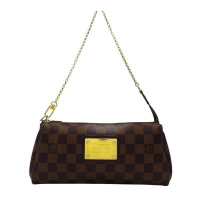 Pre-owned Louis Vuitton Eva Canvas Clutch Bag () In Brown