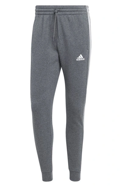 Shop Adidas Originals Adidas Essentials Fleece Tapered Joggers In Dark Grey Heather