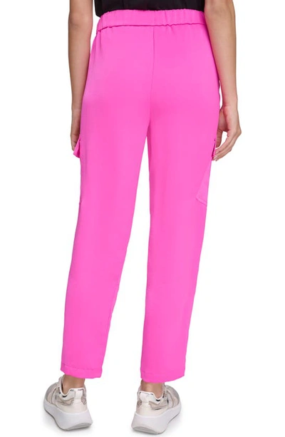Shop Dkny Cargo Ankle Pants In Shocking Pink