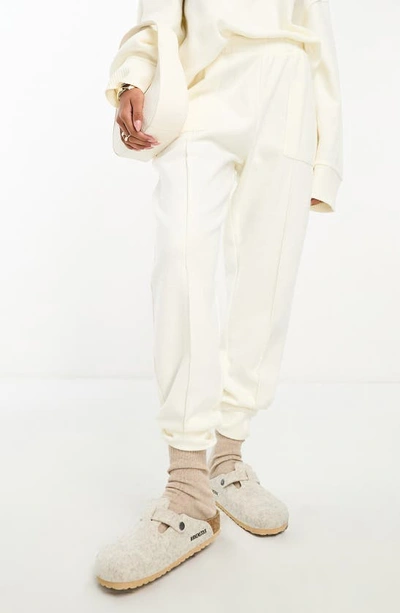 Shop Asos Design Pintuck Joggers In White