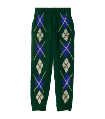 Shop Burberry Argyle Knitted Trousers In Green