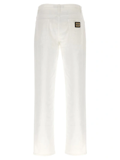 Shop Dolce & Gabbana Logo Plaque Jeans In White