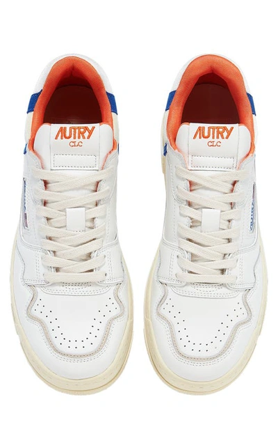 Shop Autry Clc Low Top Sneaker In White/ Orange/ Blue