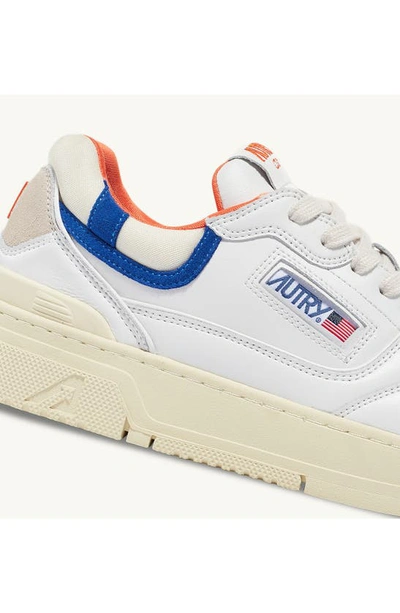 Shop Autry Clc Low Top Sneaker In White/ Orange/ Blue