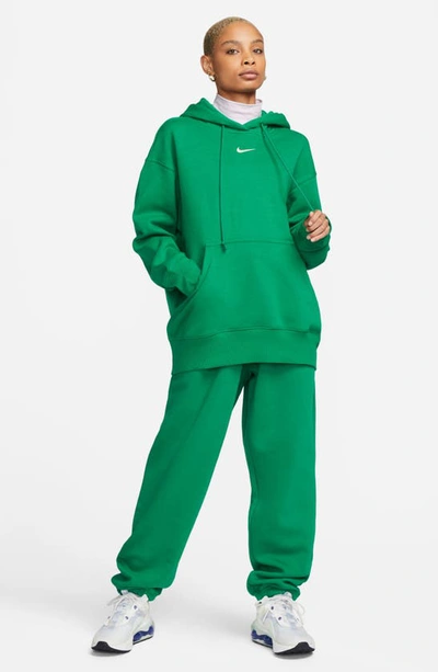 Shop Nike Sportswear Phoenix Oversize Fleece Hoodie In Malachite/ Sail