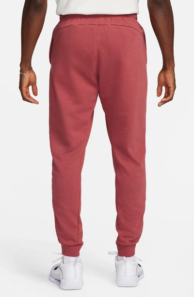 Shop Nike Court Heritage French Terry Joggers In Cedar