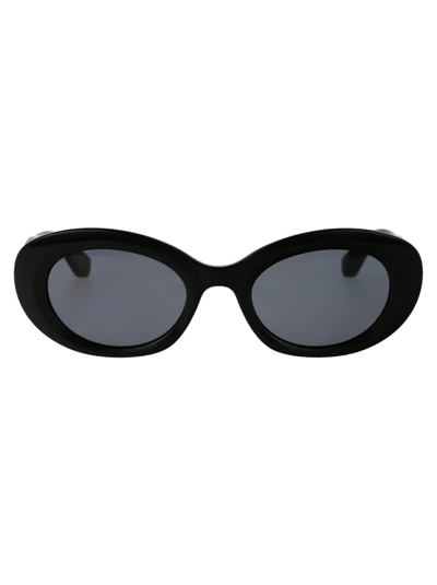 Shop Longchamp Oval Frame Sunglasses In Black