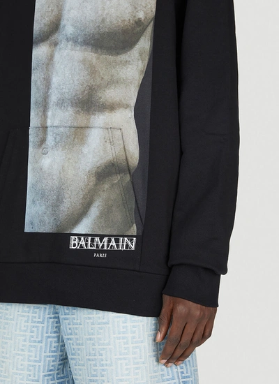 Shop Balmain Men Statue Print Hooded Sweatshirt In Black