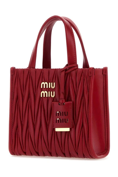 Shop Miu Miu Handbags. In Red