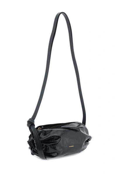 Shop Jil Sander Cushion Crossbody Bag In Black