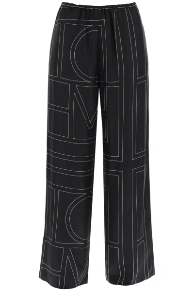 Shop Totême Monogram Embroidered Pajama Pants In Black