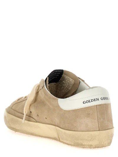 Shop Golden Goose Superstar Sneakers Beige