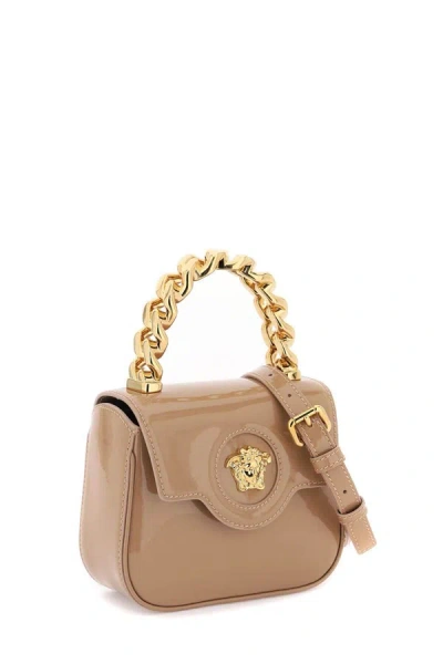 Shop Versace Patent Leather 'la Medusa' Mini Bag In Beige
