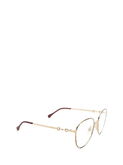 Shop Gucci Eyewear Eyeglasses In Gold / Havana