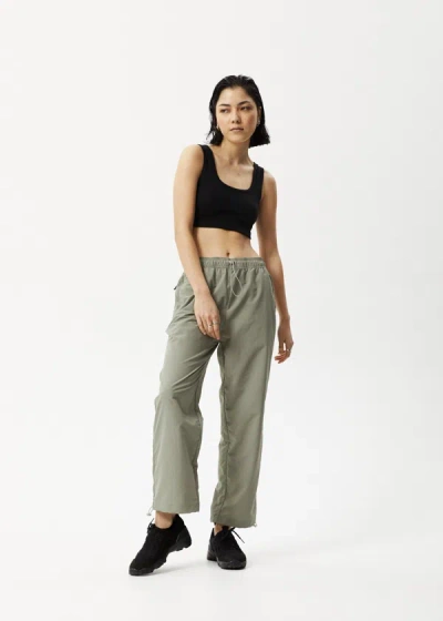 Shop Afends Spray Pants In Green