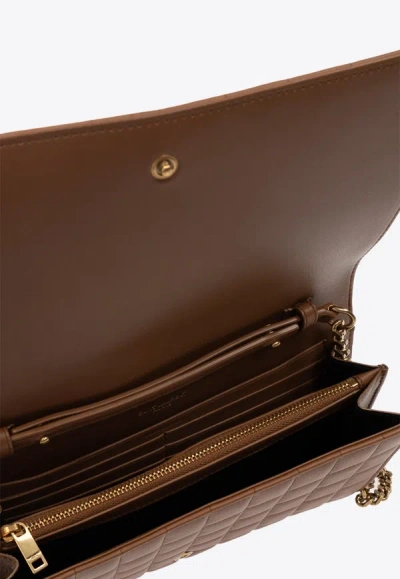 Shop Saint Laurent Cassandre Quilted Leather Clutch Bag In Brown