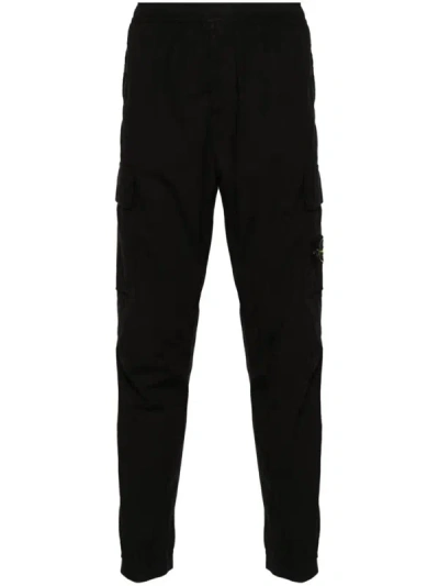 Shop Stone Island Tapered Pants With Pockets Clothing In Black