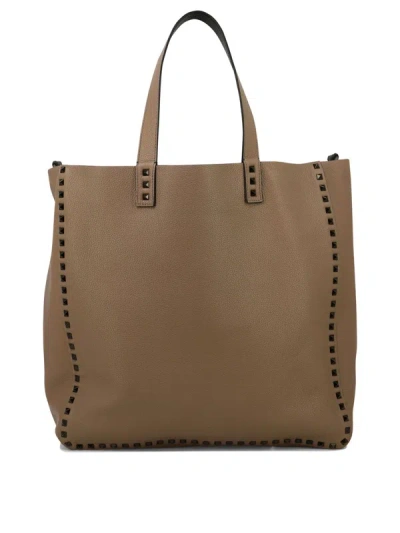 Shop Valentino Garavani "rockstud" Shoulder Bag In Brown