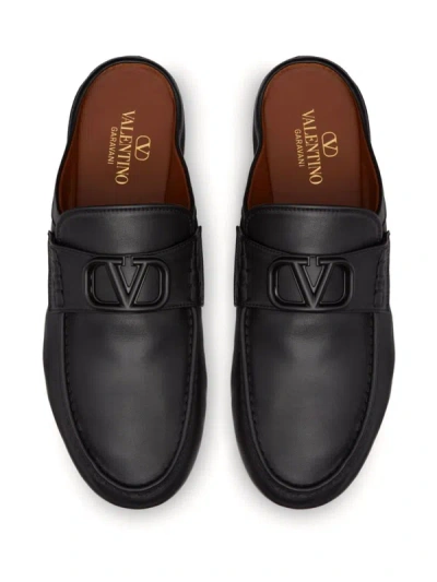 Shop Valentino Garavani Vlogo Signature Leather Slippers In Black
