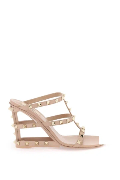 Shop Valentino Garavani Cut Out Wedge Mules With