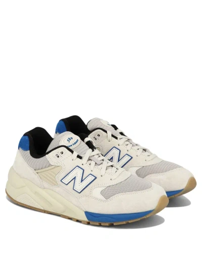 Shop New Balance "580" Sneakers
