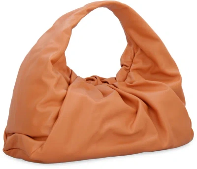 Shop Bottega Veneta Shoulder Pouch In Leather In Orange