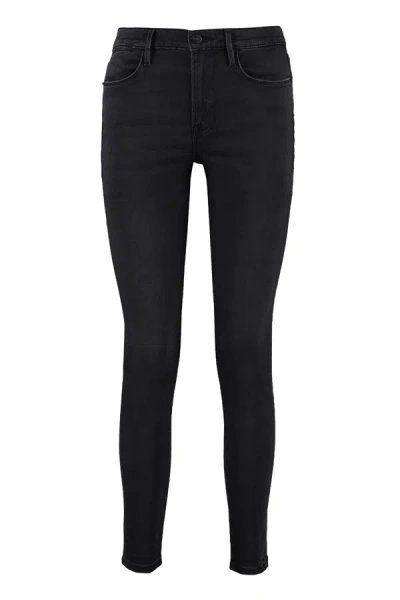 Shop Frame High-rise Skinny Jeans In Black