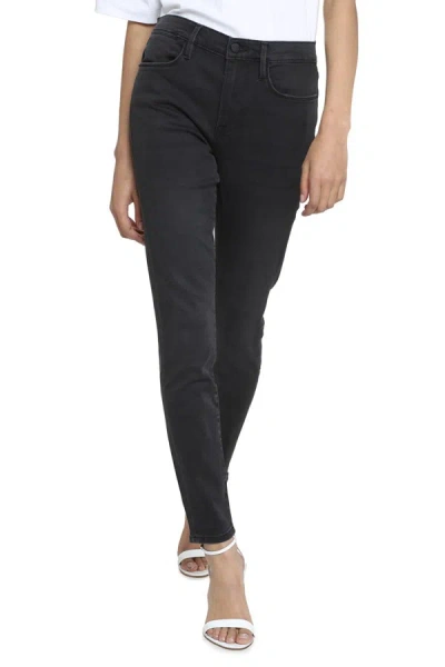 Shop Frame High-rise Skinny Jeans In Black