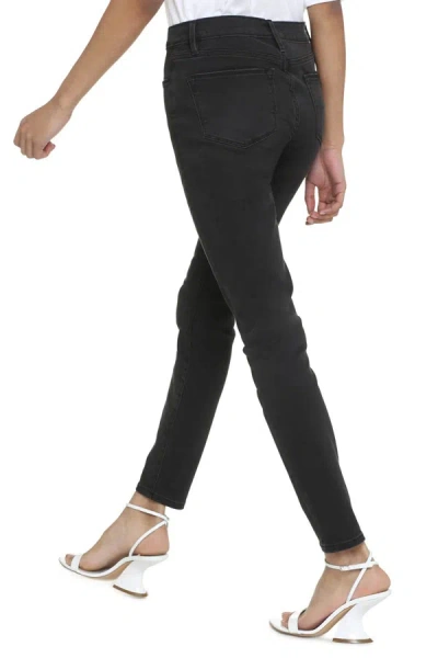 Shop Frame High-rise Skinny Jeans In Black